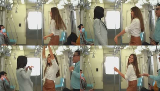 形形色色的人一起跳舞，拥挤地在地铁里听音乐。在公共交通上跳舞很有趣高清在线视频素材下载
