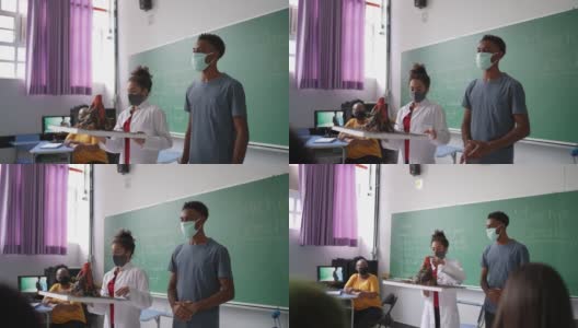 学生在教室里用口罩做关于火山的演讲高清在线视频素材下载