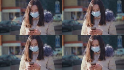 在城市街道上，一名妇女戴着医用口罩，以防止空气污染和冠状病毒感染高清在线视频素材下载