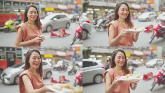 4K群亚洲人朋友一起走在唐人街一起吃街头小吃高清在线视频素材下载