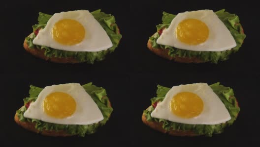 俯瞰美味的新鲜三明治与烤面包，绿色沙拉和鸡蛋高清在线视频素材下载