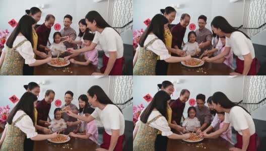 几代亚洲华人家庭欢度春节，享用传统美食高清在线视频素材下载