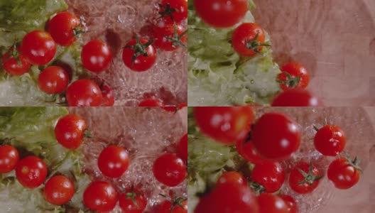 从上到下:鲜红的圣女果落在铺满水的切菜板上。高清在线视频素材下载