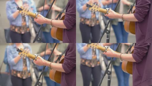街头音乐家弹奏吉他的慢镜头180fps高清在线视频素材下载