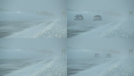 冬季暴风雪与吹雪横跨高速公路和车辆高清在线视频素材下载