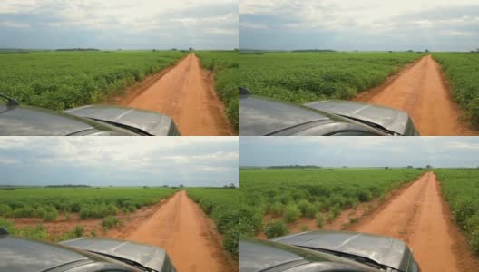 农民驾车行驶在大豆种植园的田地之间，外观高清在线视频素材下载
