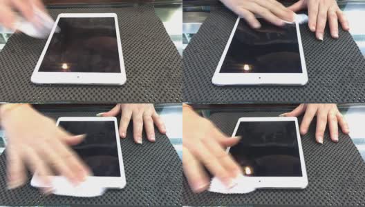 女性手部清洁屏幕的数字平板电脑高清在线视频素材下载
