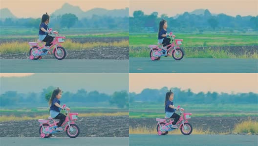 在乡下骑自行车的亚洲小女孩高清在线视频素材下载