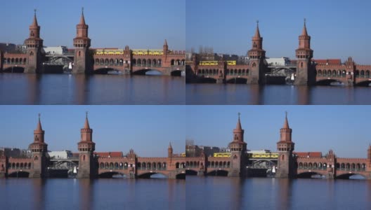 一辆黄色的地铁列车驶过柏林的奥伯本大桥高清在线视频素材下载
