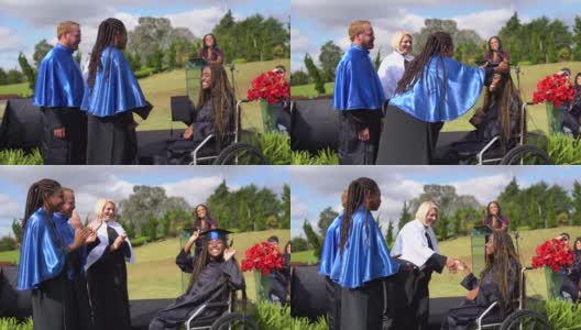 一名坐在轮椅上的大学生在毕业典礼上领取毕业证书高清在线视频素材下载