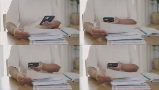 近距离拍摄女性手用手机做账单的手机支付条形码和二维码高清在线视频素材下载