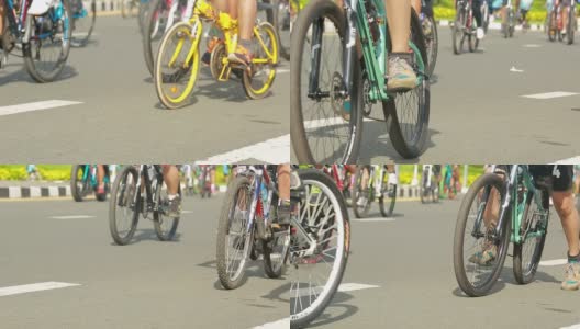 一群骑自行车的人在街上进行自行车运动高清在线视频素材下载