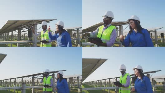 穿着蓝色防护服的亚洲中年技术员和穿着反光布的非洲工程师一起工作和检查太阳能农场，使用数字平板电脑，通过无线电与团队沟通，侧视图高清在线视频素材下载