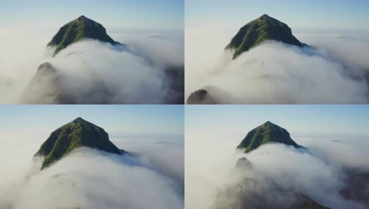 空中的全景。高高的绿峰上面密集的白云环绕着高清在线视频素材下载