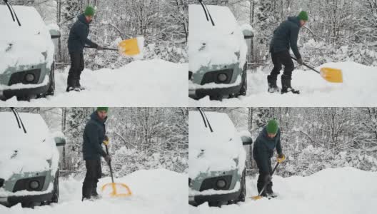 大雪过后，一名男子正在铲雪车附近的道路。冬天天气恶劣，自然灾害严重。由于暴风雪，清理后院区域的人员。高清在线视频素材下载