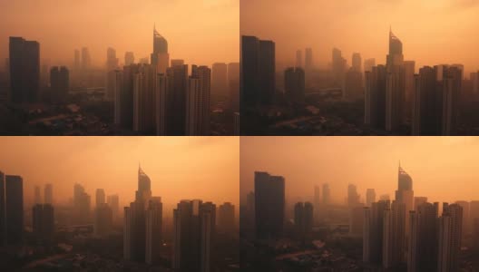 橘黄色的天空和浓雾笼罩着雅加达的天际高清在线视频素材下载