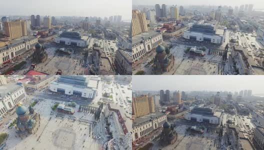 建筑和人群拥挤在哈尔滨圣索菲亚大教堂附近的4k广场上高清在线视频素材下载