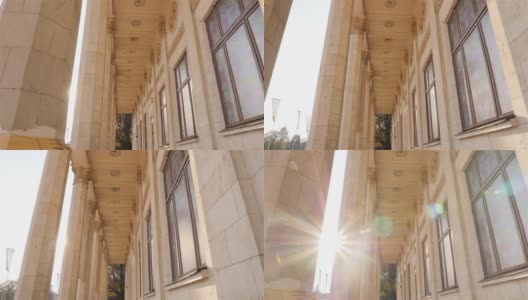 美丽的历史列。相机运动。高层建筑。太阳射线。缓慢的运动。乌克兰。基辅，11.07.18公园VDNH高清在线视频素材下载