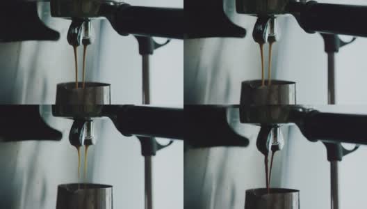浓缩咖啡机正在煮新鲜的咖啡。将咖啡从机器中倒入钢杯中。咖啡壶里的浓缩咖啡。酿造。美味的咖啡。咖啡因高清在线视频素材下载