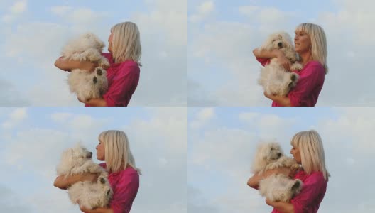 高清慢动作:女人宠爱她的狗高清在线视频素材下载