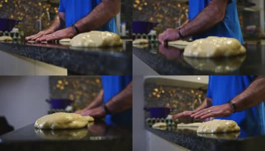 一个面包师在厨房台面上揉面团的慢动作镜头高清在线视频素材下载