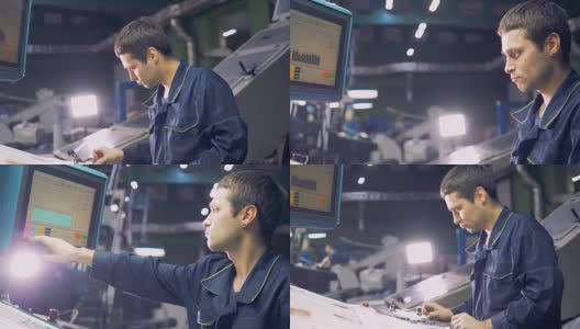 在工厂使用电脑操作机器的工人。高清在线视频素材下载