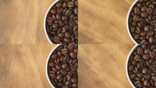 黑咖啡豆会旋转。咖啡豆的特写。美丽的咖啡种子。高清在线视频素材下载