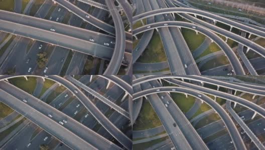 晴天，中国大城市成都高架路和交通枢纽的上下角无人机视图。现代建筑设计的交通方式避免了交通堵塞，车辆很多高清在线视频素材下载