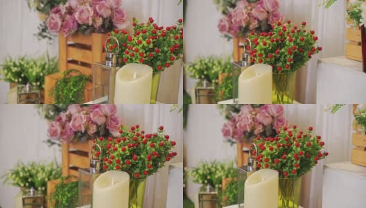婚礼装饰，桌上有一束人造花和蜡烛。高清在线视频素材下载