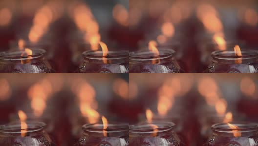 在佛教寺庙里点燃蜡烛高清在线视频素材下载