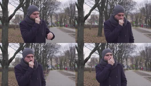 一个男人在街上咳嗽，慢镜头射击高清在线视频素材下载
