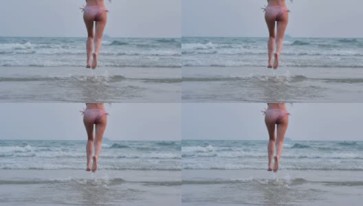少女在沙滩上跳跃，奔跑，享受。的生活方式。自由。旅行。假期——iStock高清在线视频素材下载