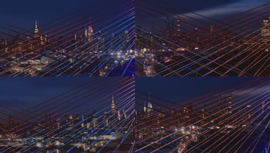 在灯火通明的科修斯科大桥上，曼哈顿中城天际线的夜景。航拍视频与平移摄像机运动。高清在线视频素材下载