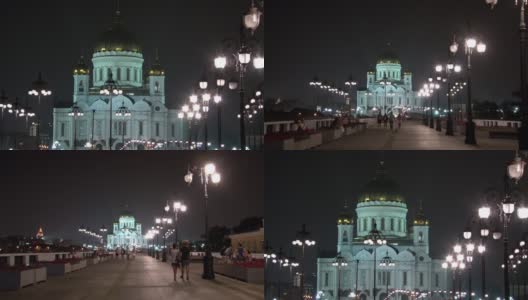 晚上，人们沿着宗法桥走到救世主大教堂。高清在线视频素材下载