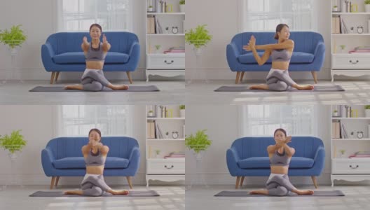 平静的亚洲女性穿着运动服，伸展肌肉，热身呼吸和冥想，在家做瑜伽，健康的女性做瑜伽，感觉如此舒适和放松，健康瑜伽保健概念高清在线视频素材下载