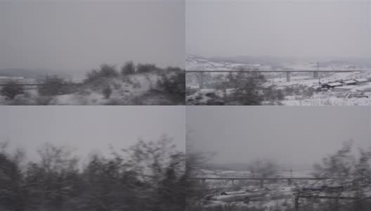 被积雪覆盖的高速公路高架桥和从客车车窗上可以看到的植被的冬季景观正在上演高清在线视频素材下载