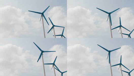 三个风力涡轮机在蓝天上发电高清在线视频素材下载