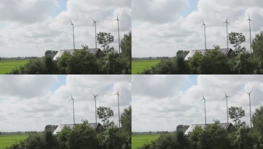农舍上有三个小型风车和太阳能电池板高清在线视频素材下载