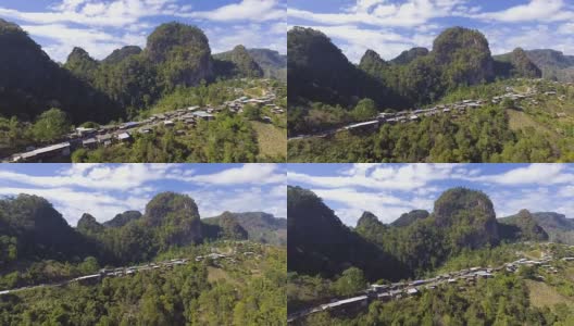 鸟瞰图的小村庄在山上与美丽的山峰在早上高清在线视频素材下载