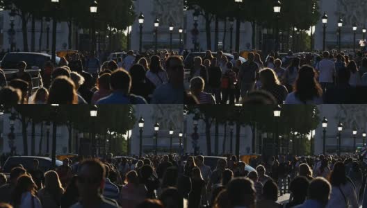 游客们在傍晚的阳光下漫步在香榭丽舍大街上高清在线视频素材下载