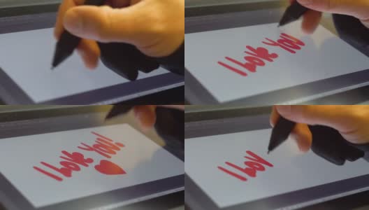 男人的手写着红色的爱情题词高清在线视频素材下载