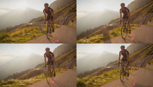 日落时分在山口上骑公路自行车高清在线视频素材下载