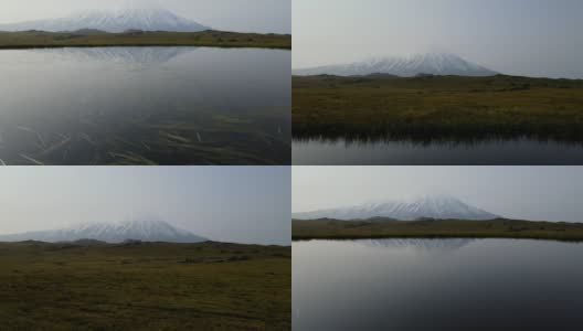 早晨湖面上火山的倒影高清在线视频素材下载