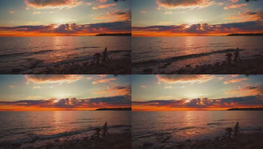 随着时间的推移，在风景优美的自然浪漫的平静的海水海滩上，太阳从地平线落下，克罗地亚地中海海滨的小波浪像一个大的橙色球。户外旅游度假日落cinemagraph无缝视频循环im 4K超高清。高清在线视频素材下载