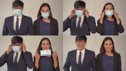 办公室里，一群快乐的亚洲商务人士脱下防护口罩，微笑着迎接新冠肺炎或新冠肺炎大流行的结束。摘掉医用口罩。希望在一个新的正常的人高清在线视频素材下载