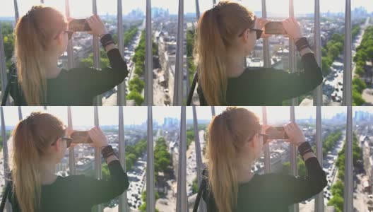 游客在凯旋门上拍摄巴黎的照片高清在线视频素材下载