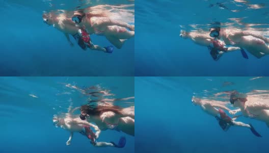 POV男人和女人手拉手跳水高清在线视频素材下载