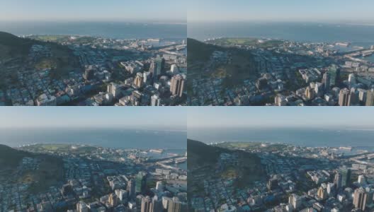 空中全景镜头的各种建筑物在城市附近的海滨。城市中心的高层建筑。南非开普敦高清在线视频素材下载