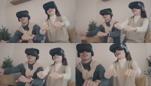 Metaverse:幸福的亚洲夫妇玩虚拟现实耳机高清在线视频素材下载