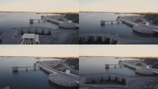 葡萄牙水电站大坝上的阿尔奎瓦湖河鸟瞰图。日落时分楼宇维修高清在线视频素材下载